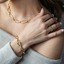 Load image into Gallery viewer, person wearing the Capucine de Wulf Maharani Grande Chain Bracelet and matching necklace and ring