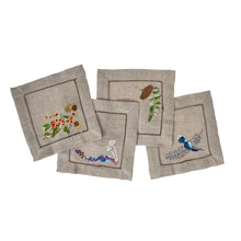 Load image into Gallery viewer, four tan square napkins with an embroidered designs