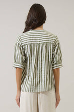 Load image into Gallery viewer, Person wearing Catana Striped Split Neck Top green and white stripes with white pants back view shirt untucked