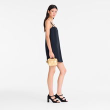 Load image into Gallery viewer, person holding Longchamp Le Pliage Xtra Crossbody Bag Gold