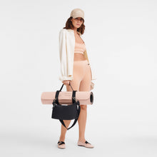 Load image into Gallery viewer, Person carrying the Longchamp Le Pliage Energy M Yoga Bag in Black