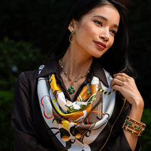 Load image into Gallery viewer, person wearing a Capucine de Wulf Berry Clover Double Sided Pendant with green petals and gold center