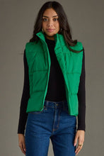 Load image into Gallery viewer, woman in a puffy Classic Green Vest paired with a black shirt and jeans