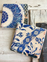 Load image into Gallery viewer, two coasters with blue and cream floral designs