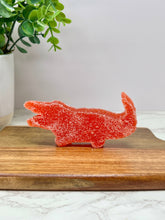 Load image into Gallery viewer, Florida Citrus Candy, Alligator Delicacy, Orange, 2oz on a cutting board