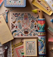 Load image into Gallery viewer, Rifle Paper Home Sweet Home Umbrella closed on a table with other Rifle Paper items