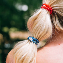 Load image into Gallery viewer, person with a red and blue hair ties in their hair