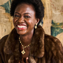 Load image into Gallery viewer, person wearing Capucine de Wulf Berry Clover Double Sided Pendant with Blue Labradorite and matching gold earrings