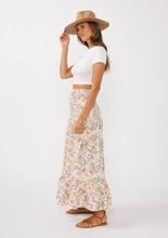 Load image into Gallery viewer, person wearing Convertible Floral Smocked Skirt - Cream/Dusty Lilac paired with white shirt