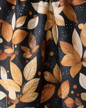 Load image into Gallery viewer, close up of fabric patter of orange and brown leaves on a black background