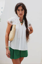 Load image into Gallery viewer, woman in the White Maya Embroidered Blouse paired in green shorts