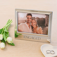 Load image into Gallery viewer, Mariposa Engaged Signature 4x6 Frame on a table next to a tray with rings