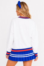Load image into Gallery viewer, woman wearing the Florida Heritage V-Neck Pullover back view showing white fabric