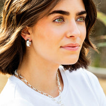 Load image into Gallery viewer, person wearing a Capucine de Wulf Jewelry Cleopatra Classic Hoop Earrings in silver and similar necklace
