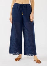 Load image into Gallery viewer, wide leg blue cotton pants with eyelet design along the border and a tie waistline