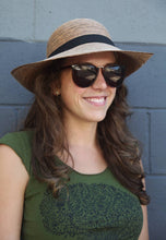 Load image into Gallery viewer, woman in sunglasses wearing the Chloe Hand-woven Palm Hat