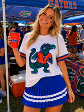 Load image into Gallery viewer, person wearing Florida Sparkle Logo T-Shirt showing sequins in design at a gator party