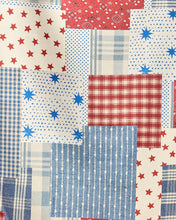 Load image into Gallery viewer, close up of red and blue stars and stipe patchwork fabric