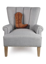 Load image into Gallery viewer, Brown Cowboy Boot shaped Hook Pillow on a chair