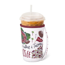 Load image into Gallery viewer, Swig Saturdays In Tallahassee Iced Cup Coolie showing handle and holding an iced coffee cup
