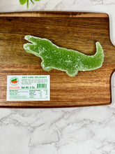 Load image into Gallery viewer, green gummy candy on a cutting board with the information tag next to it