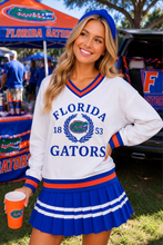 Load image into Gallery viewer, woman wearing the Florida Heritage V-Neck Pullover at a gator party