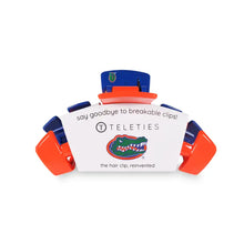 Load image into Gallery viewer, Orange and blue hair clip with teleties information