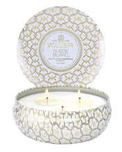 Load image into Gallery viewer, Voluspa Suede Blanc 3 Wick Tin Candle with three wicks lit