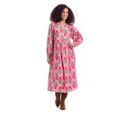 Load image into Gallery viewer, woman wearing long pink dress with long sleeves red and green print pattern