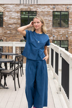 Load image into Gallery viewer, woman in the Hayley Linen Pants in blue paired with a matching top
