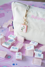 Load image into Gallery viewer, Mahjong Tile Enamel Bag Charm in Pink on a bag with games pieces scattered around