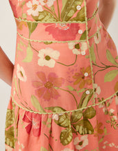 Load image into Gallery viewer, close up of button front with green trim and floral print