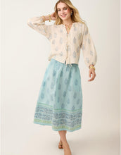 Load image into Gallery viewer, woman wearing Estelle Midi Skirt Lightner Camellia Blue with cream colored top