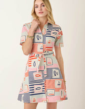 Load image into Gallery viewer, woman in with fish and sail boat themed pattered short sleeve mid length button up dress
