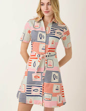 Load image into Gallery viewer, woman in with fish and sail boat themed pattered short sleeve mid length button up dress