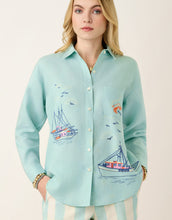 Load image into Gallery viewer, woman in blue button but 3/4 sleeves embroidered with boats