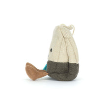 Load image into Gallery viewer, Side view of Jellycat Amuseables Steepy Tea Bag plush with a folded cream body, gray base, and corduroy feet.