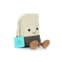 Load image into Gallery viewer, Jellycat Amuseables Steepy Tea Bag plush with a smiling face, brown corduroy feet, and turquoise tea tag