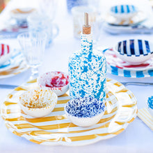Load image into Gallery viewer, Vietri Amalfitana Splatter Olive Oil Bottle can bowls on a striped plate