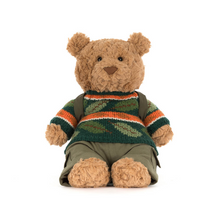 Load image into Gallery viewer, Stuffed teddy bear wearing a striped sweater and backpack on a white background