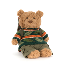 Load image into Gallery viewer, Stuffed teddy bear wearing a striped sweater and backpack on a white background