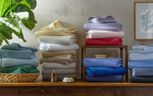 Load image into Gallery viewer, stacks of colorful towels