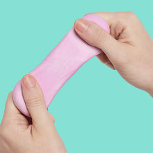Load image into Gallery viewer, hands holding pink Speks Blur Calming Focus Putty
