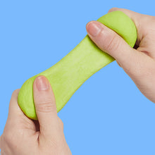 Load image into Gallery viewer, hands holding green Speks Blur Calming Focus Putty