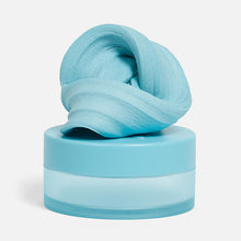 Load image into Gallery viewer, Speks Blur Calming Focus Putty in light blue sitting on its storage container
