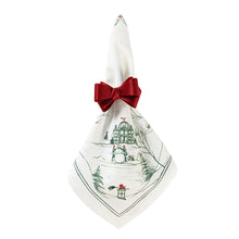 Load image into Gallery viewer, white napkin with green winter country estate designs with red accents in a red bow napkin holder