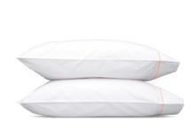 Load image into Gallery viewer, Two pillows with Matouk Essex pillowcases with two simple lines of embroidery in pink, one line a slightly lighter shade than the other