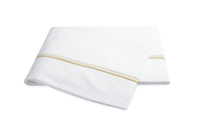 Load image into Gallery viewer, Matouk Essex flat sheet with two simple lines of embroidery in Champagne, one line a slightly lighter shade than the other