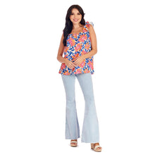 Load image into Gallery viewer, woman in flower print shirt and blue jeans