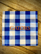 Load image into Gallery viewer, royal blue and white checked cocktail napkin with GATORS printed on it in orange by Caspari, custom printed by AGAPANTHUS